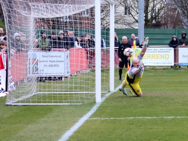 Portchester keeper Steve Mowthorpe is beaten by Tom Settle's penalty. Picture by Ken Walker