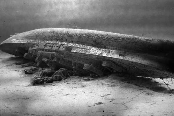 HMS Royal Oak on the seabed at Scapa Flow. The wreck of Royal Oak, a designated war grave, lies almost upside down in 100 feet (30 m) of water with her hull 16 feet (4.9 m) beneath the surface. In an annual ceremony to mark the loss of the ship, Royal Navy divers place a White Ensign underwater at her stern