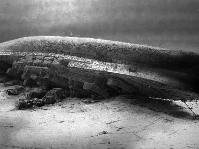 HMS Royal Oak on the seabed at Scapa Flow. The wreck of Royal Oak, a designated war grave, lies almost upside down in 100 feet (30 m) of water with her hull 16 feet (4.9 m) beneath the surface. In an annual ceremony to mark the loss of the ship, Royal Navy divers place a White Ensign underwater at her stern