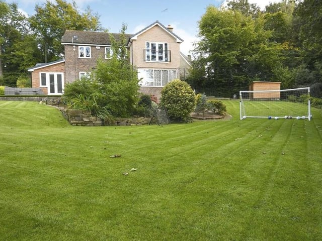 The garden is fit for relaxation or for playing games. This photo also gives a good view of the balcony to the master bedroom.