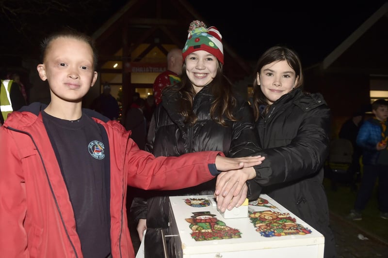 Connor Brown (11), Ruby Boot (11) and Holly Thorne (10) turned on the Lee-on-the-Solent Christmas lights.   Picture: Sarah Standing (291124-6843)
