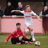 Horndean's Zack Willett (white) netted twice in a 3-0 win against Baffins Milton Rovers. Picture: Keith Woodland