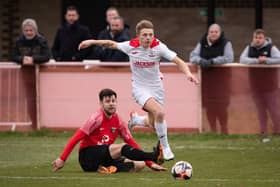 Horndean's Zack Willett (white) netted twice in a 3-0 win against Baffins Milton Rovers. Picture: Keith Woodland