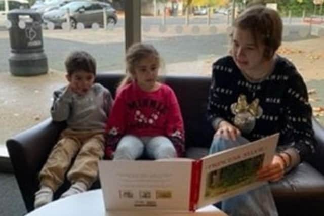 Poppy Ryder, level six Illustration student, reading to children. Pic Portsmouth University
