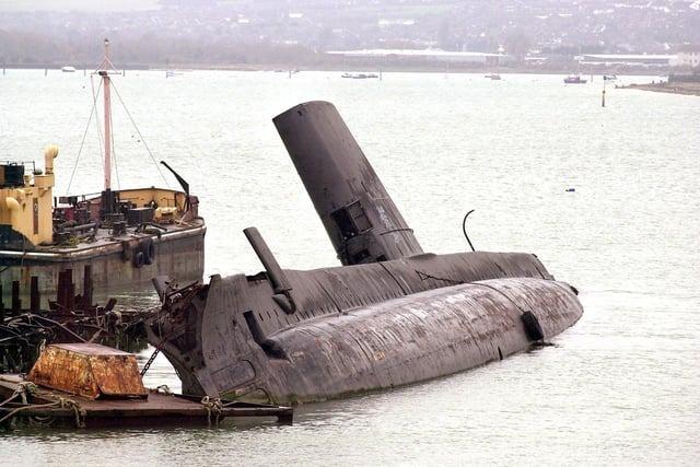 The former HMS Osiris languishing in Pounds Shipyard at Tipner beside the M275, at the entrance to Portsmouth. Pictured 20th November 2002