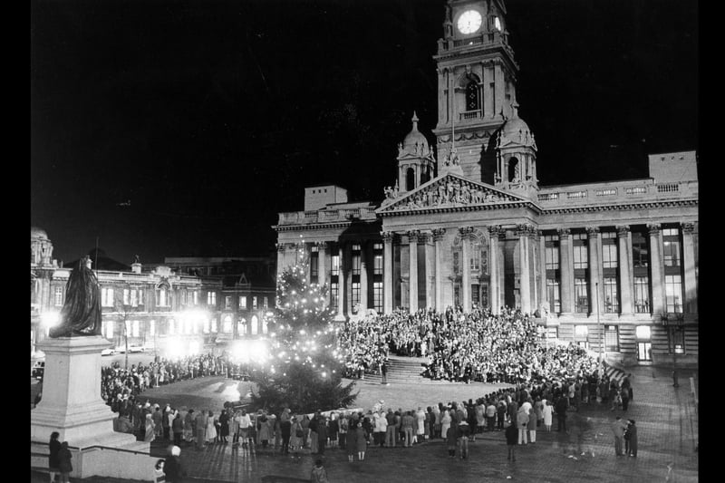 The scene in the Guildhall Square where hundreds of Portsmouth school children enjoyed the annual carol service, 1983. The News PP5094
