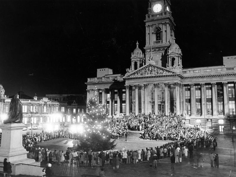 The scene in the Guildhall Square where hundreds of Portsmouth school children enjoyed the annual carol service, 1983. The News PP5094