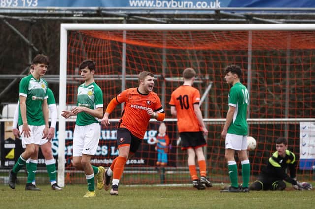 Portchester (orange) celebrate their second goal. Picture: Stuart Martin