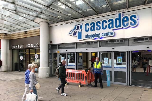 Shops across Commercial Road have had staff guiding customers to queue outside, including the Cascades Shopping Centre. Picture: Richard Lemmer