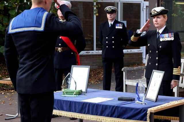 Captain Sophie Shaughnessy, the head of people operations in the Royal Navy presents awards and certificates to passing out class ME150/20/012 at HMS Sultan in Gosport.