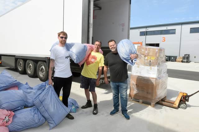 Charity Stella's Voice have been running a donation centre in the Meridian Centre in Havant and on Tuesday, May 17, had an artic lorry loaded up from Spring Business Park in Havant and driven to Romania where it will be taken to a refugee centre which will then be distributed in Ukraine.

Pictured is: (l-r) Rob Burdell, Graham Stouse and Wayne Keeping.

Picture: Sarah Standing (170522-7327)
