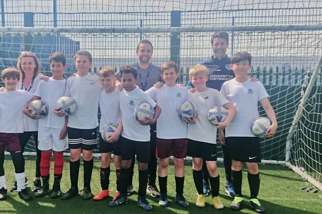 Danny Cowley lead a training session at Portsmouth FC's training ground, in Hilsea, for the Meon Junior School football team, ahead of their Utilita Kids Cup final at Wembley, on May 21. Pictured is Danny Cowley, Meon Junior school teachers, Michael Spencer and Shellie Knight, along with the squad, on May 6, 2022. The players include Leo Higgins and Lewis Hamza, aged 10, alongside Lorenzo Jay, Teddy Nightingale, Freddie Seabrook, Rafael Taylor-Stoakes, Anbiya Habibi, and Leon Young, all aged 11. Picture: Freddie Webb.