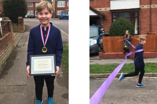 Oliver Shann, 10 from Elson, ran a marathon in January for Cancer Research UK. Pictured: Oliver with his medal and certificate and, right, crossing the finish line