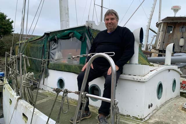 Ian Hill sitting on his boat Andiamo at Forton Lake in Gosport. Picture: Toby Paine