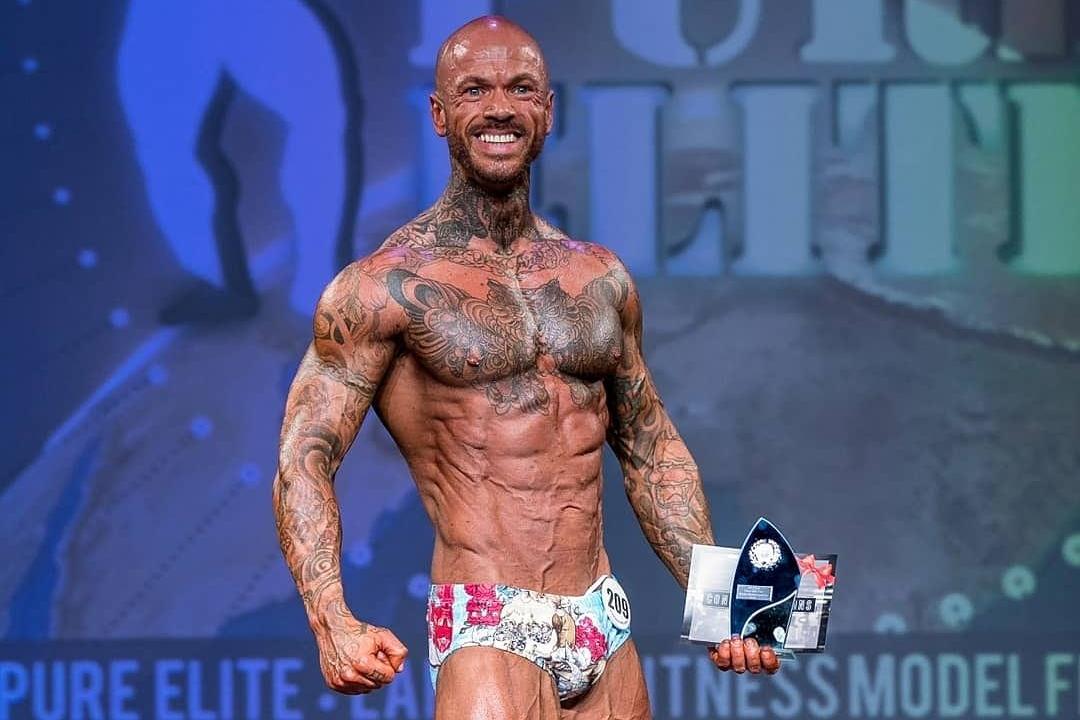 Tattooed bodybuilder on sale