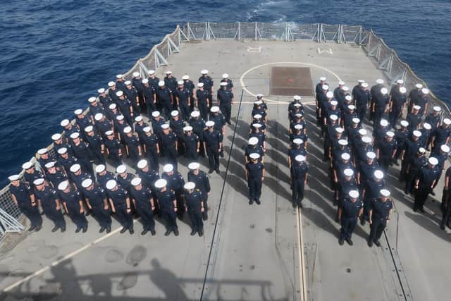 The ship's company of HMS Montrose gather  in the Gulf to honour the Queen.
Photo: SLt Salisbury