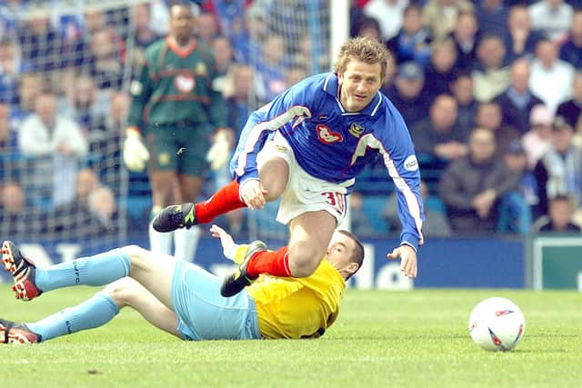 Tim Sherwood takes a tumble after being tackled by Sheffield Wednesday's Brian Barry-Murphy when the sides last met in April 2003. Picture: Matthew Fearn