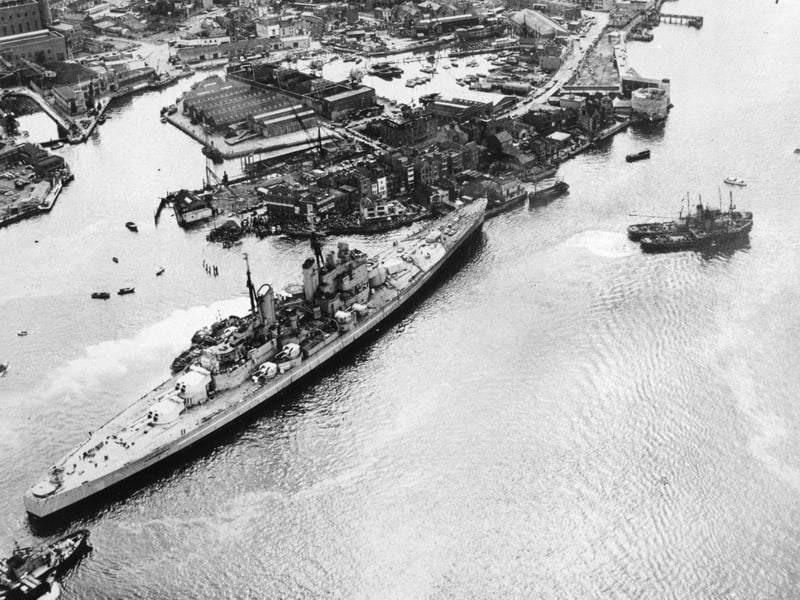 HMS Vanguard runs aground in Portsmouth Harbour after breaking loose, but narrowly avoids the Still & West pub,  August 4, 1960. The News PP5335