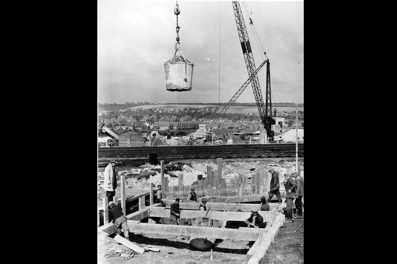 The crane carries giant buckets of cement for the builders to use for foundations on Eastern Road in 1938. The News PP5280