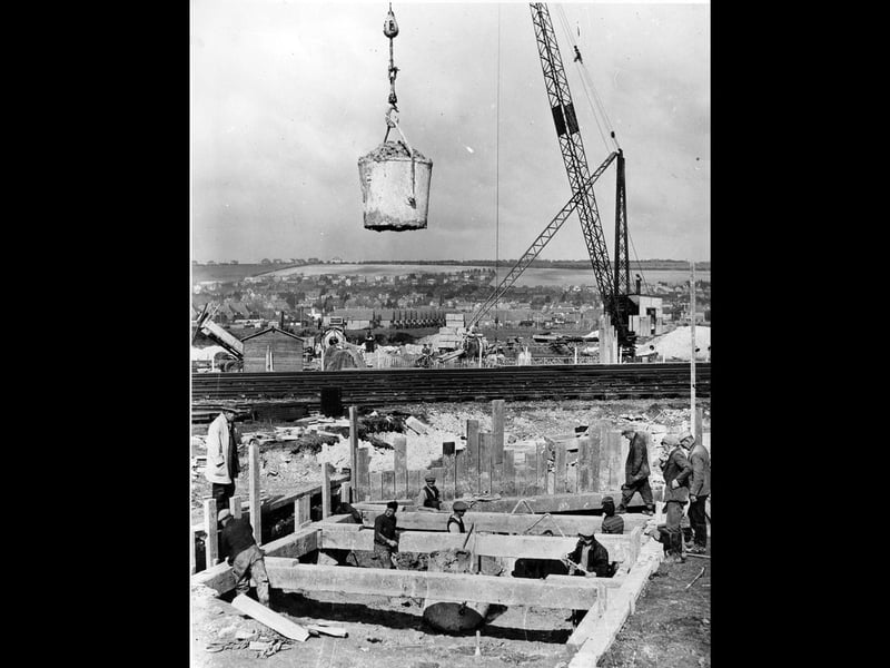 The crane carries giant buckets of cement for the builders to use for foundations on Eastern Road in 1938. The News PP5280