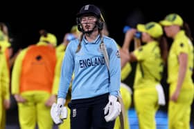 England's Charlie Dean reacts after her dimissal during the 2022 Women's Cricket World Cup final. Photo by Marty MELVILLE / AFP.