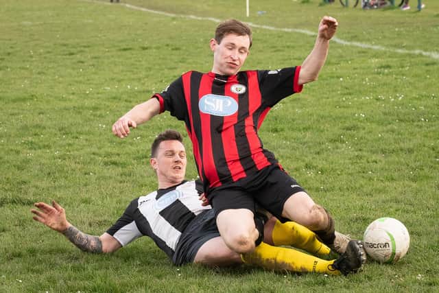 Hayling's Luke Wheatcroft tackles Lee Carvell of Locks Heath. Picture: Keith Woodland