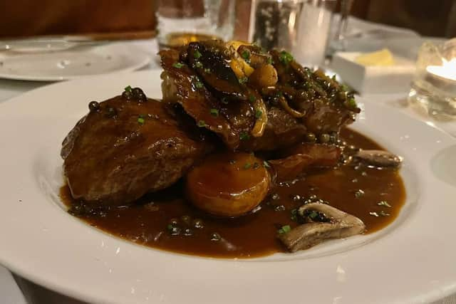 Sirloin steak with sauteed potatoes, wild mushrooms, shallots and peppercorn sauce