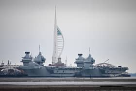 HMS Queen Elizabeth aircraft carrier alongside HMS Prince of Wales, docked in Portsmouth Navy Base, which is to be upgraded. The government has recently confirmed retirement dates for the Queen Elizabeth-class carriers. Photo by Finnbarr Webster/Getty Images
