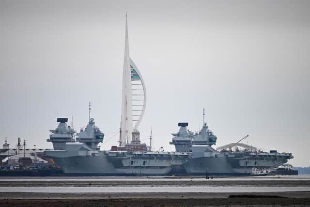 HMS Queen Elizabeth aircraft carrier alongside HMS Prince of Wales, docked in Portsmouth Navy Base, which is to be upgraded. Photo by Finnbarr Webster/Getty Images