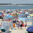 West Wittering is nicknamed “God’s Pocket” by locals for its pastel huts and sloping dunes