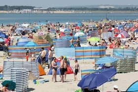 West Wittering is nicknamed “God’s Pocket” by locals for its pastel huts and sloping dunes