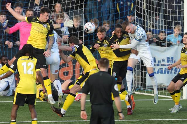 Hawks and Tonbridge Angels players contest a corner. Picture by Dave Haines