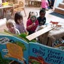 Children at Tops Southsea listen to The Three Billy Goats Gruff.
