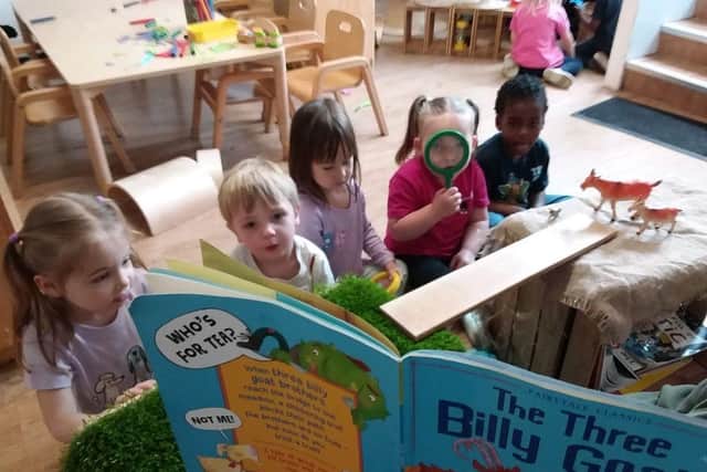 Children at Tops Southsea listen to The Three Billy Goats Gruff.
