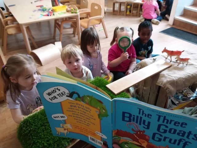 Children at Tops Southsea listen to The Three Billy Goats Gruff.