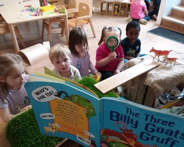 Children at Tops Southsea listen to The Three Billy Goats Gruff.