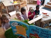 Children at Tops Southsea listen to The Three Billy Goats Gruff.