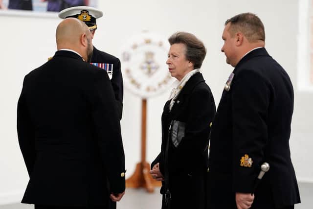Britain's Princess Anne (C), Princess Royal, as Commodore-in-Chief Portsmouth, meets with Royal Navy personnel, who took part in Queen Elizabeth II's funeral procession, at Portsmouth Naval Base on September 22, 2022. Photo by ANDREW MATTHEWS/POOL/AFP via Getty Images