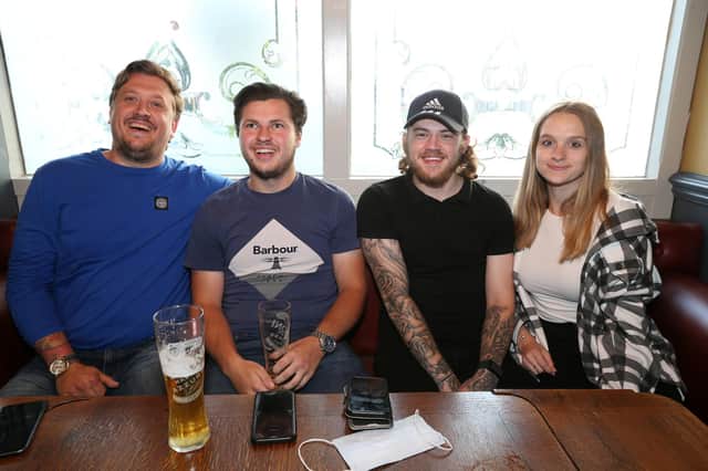 From left, Sam Sharp, Jake Binding, Ethan Mortimer and Jessica Watt. Fans watch England v Czech Reublic in England's third Group D game of Euro 2021, in The Star & Garter pub, Copnor, Portsmouth
Picture: Chris Moorhouse (jpns 220621-20)