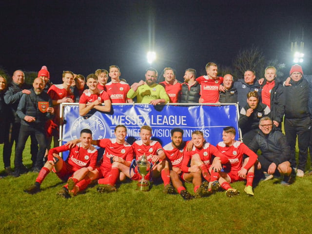 Horndean players and management celebrate. Picture by Martyn White