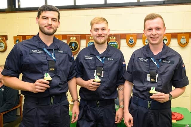 RFA sailors (left to right) James Sharp, 26, Sam Shaw 24 and Bradley Wilson 23, enjoying their cakes during Mental Health Week at HMS Collingwood. Picture by Keith Woodland, Crown Copyright