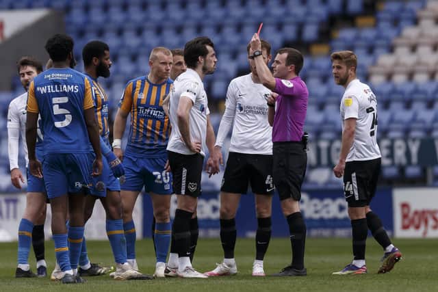 John Marquis is shown a red card and is sent off by referee Ben Speedie (Photo by Daniel Chesterton/phcimages.com)