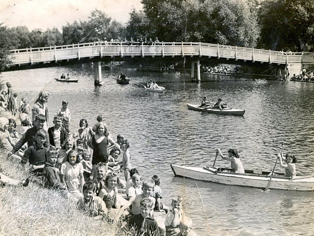 Eileen Mackley in the back of the canoe on the moat at Hilsea Lido