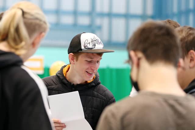 Cameron Fisher pictured with friends as he grabs his GCSE grades at UTC Portsmouth
Picture: Chris Moorhouse (jpns 120821-01)