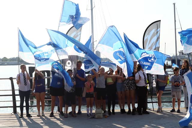 Flag-waving students from the Motiv8 charity