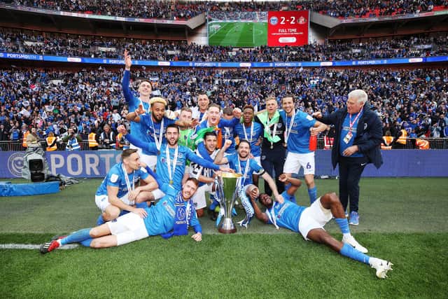 Pompey toast their EFL Trophy triumph at Wembley in March 2019. Picture: Joe Pepler