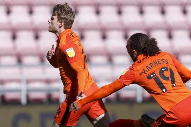 Andy Cannon celebrates after coming off the bench to score Pompey's winner at Wigan. Picture: Daniel Chesterton/phcimages.com)