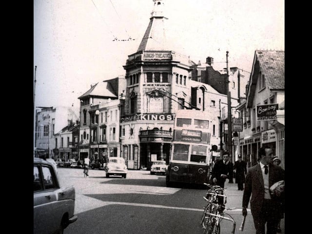 Taken in 1963. The Kings theatre has now been built on the junction with Exmouth Road and the day of the cycle seems well to the fore with so many parked against the kerb.A police constable is walking towards the photographer perhaps to the police station located just behind the photographer.Further up the road can be seen the Essoldo cinema.