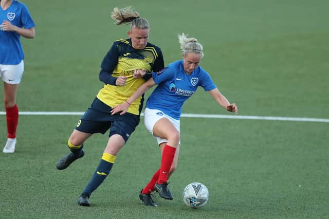 Moneyfields' Sheree Bell-Jack, left, in action against Pompey during last Thursday's Portsmouth & District FA Women's Cup final at Westleigh Park. Picture by Dave Haines.