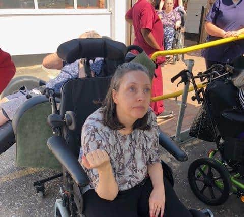 Lucy Chewins, pictured welcoming her brother and his friends to Wickham’s Winscombe Care Home on Sunday. Photo: Sam Stephenson